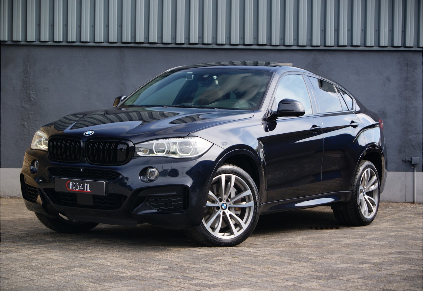 BMW X6 - xDrive50i 450PK High Executive M-Sport/Fulloptions! NL-Auto - AutoWereld.nl