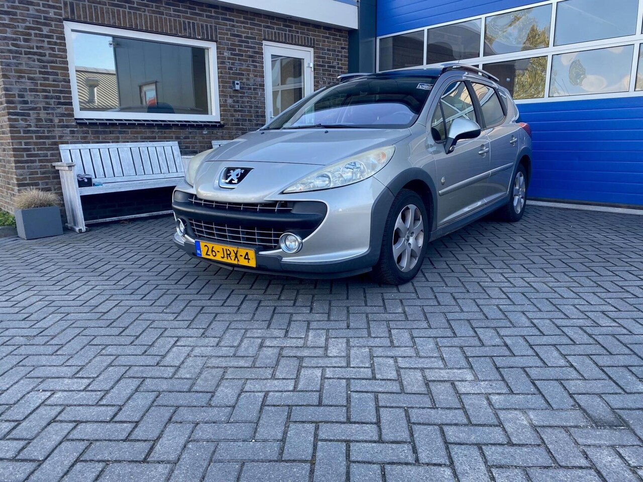 Peugeot 207 SW Outdoor - 1.6 VTi Sublime Clima Cruise pano - AutoWereld.nl