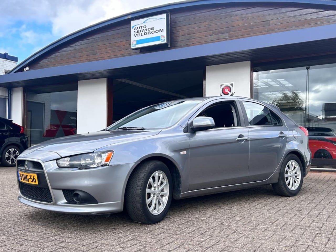 Mitsubishi Lancer Sportback - 1.6 Edition One + trekhaak - AutoWereld.nl