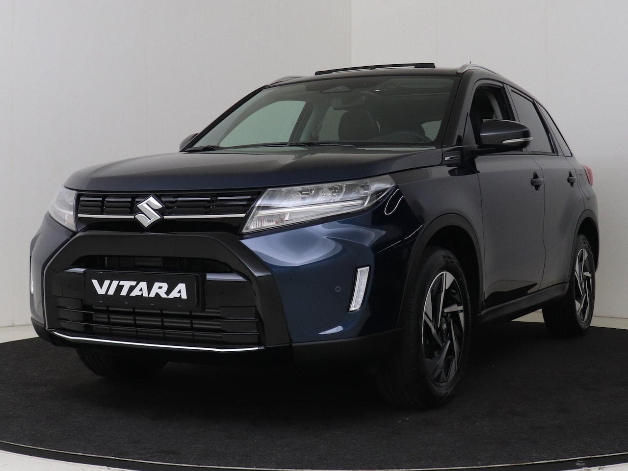 Suzuki Vitara - 1.4 Boosterjet Style Hybrid | Sunroof | Parkeersensoren Voor & Achter | Suede met Leder | - AutoWereld.nl