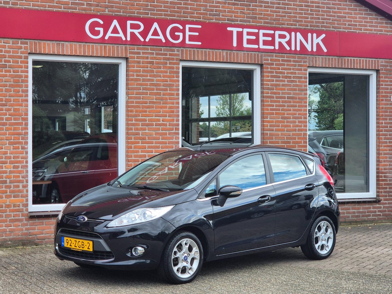 Ford Fiesta - 1.25 Titanium 82PK 5drs clima, cruise, pdc, elektr.ramen, lmv RIJKLAAR - AutoWereld.nl