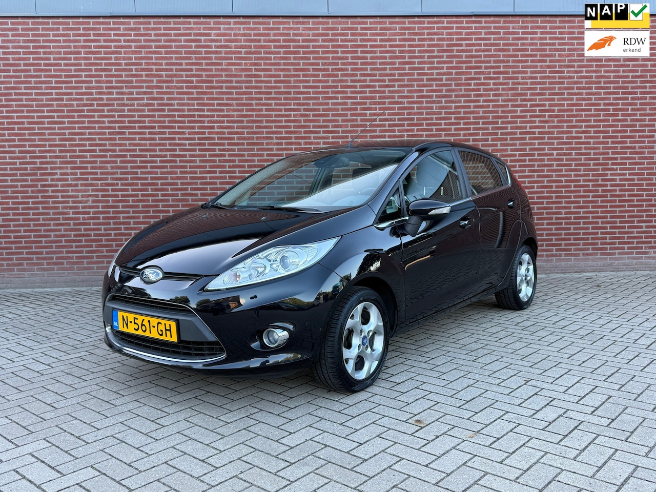 Ford Fiesta - 1.25 Ghia / Lage Km stand / Airco / Elektrische ramen - AutoWereld.nl