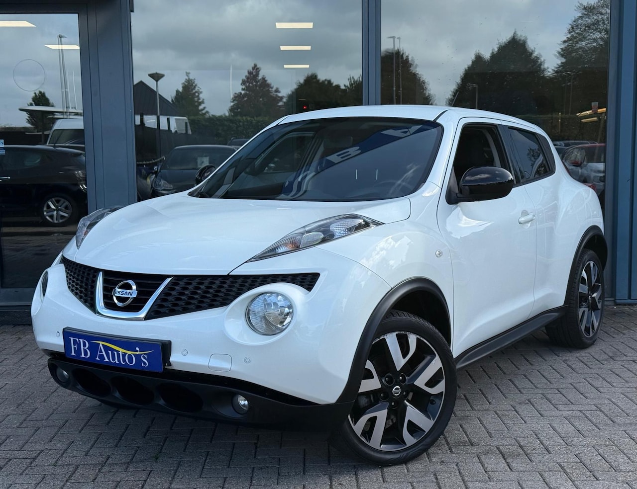 Nissan Juke - 1.6 Connect Edition Airco Cruise Navi - AutoWereld.nl