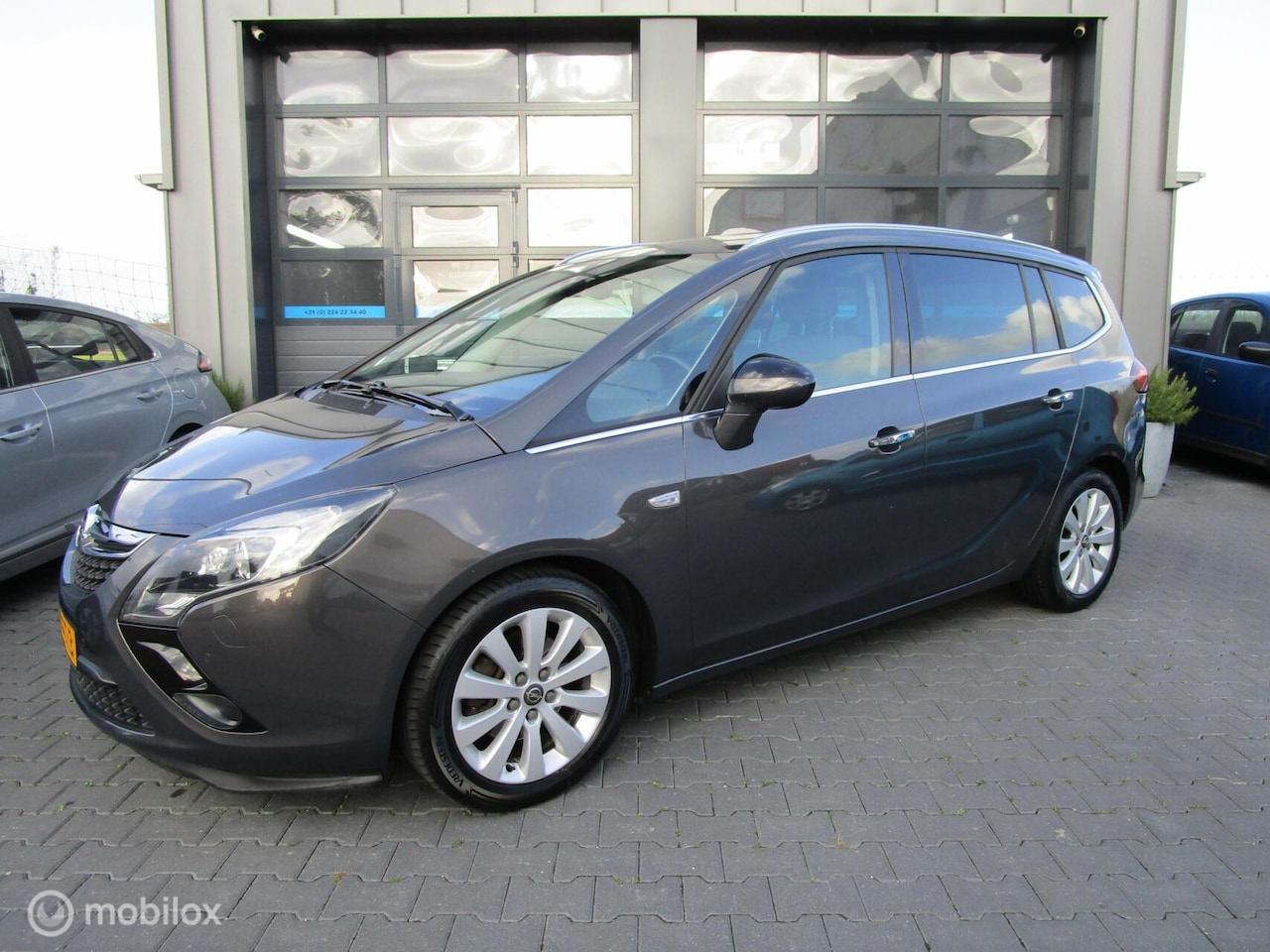 Opel Zafira Tourer - 1.4 Cosmo 7p. Airco Cruise Navi Ruimte! - AutoWereld.nl