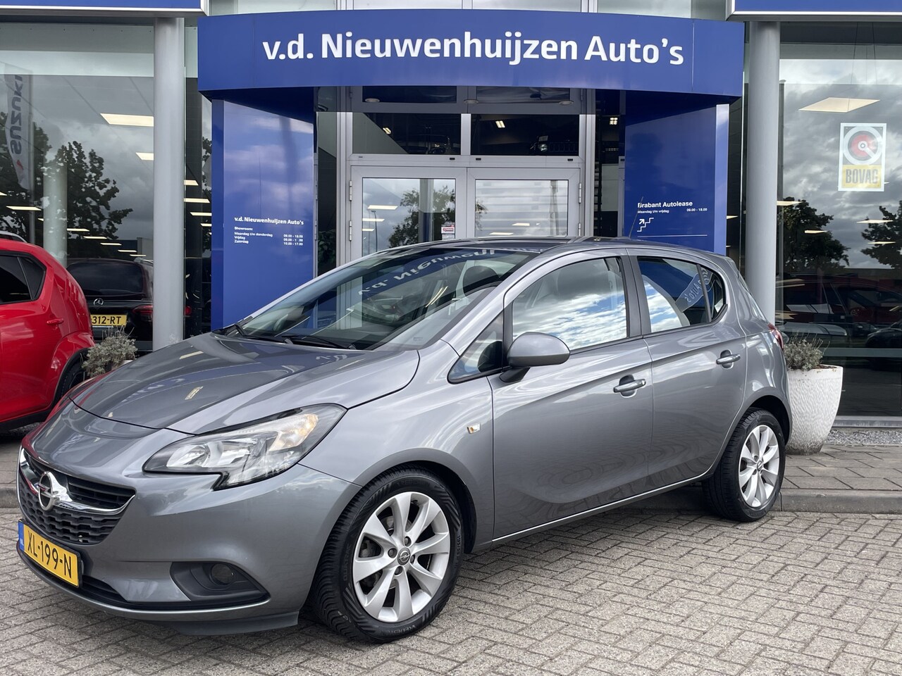 Opel Corsa - 1.4 Favourite | PDC | Navi | Cruise | - AutoWereld.nl