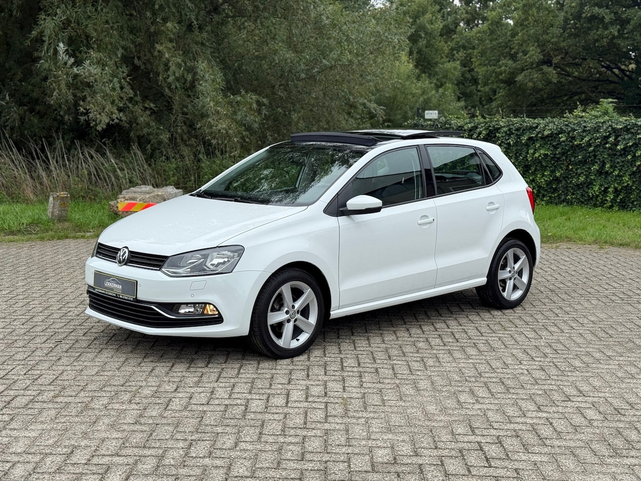 Volkswagen Polo - 1.2 TSI High Line PANO I CRUISE I PDC I 90PK I ZEER MOOI - AutoWereld.nl