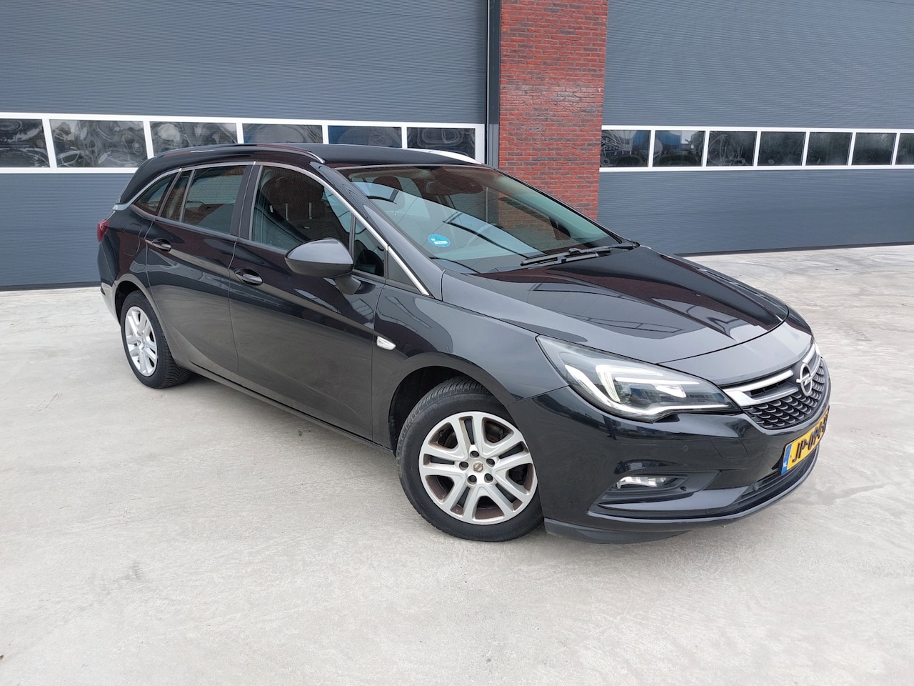 Opel Astra Sports Tourer - 1.6 CDTI Business+AIRCO/ECC/NAV - AutoWereld.nl