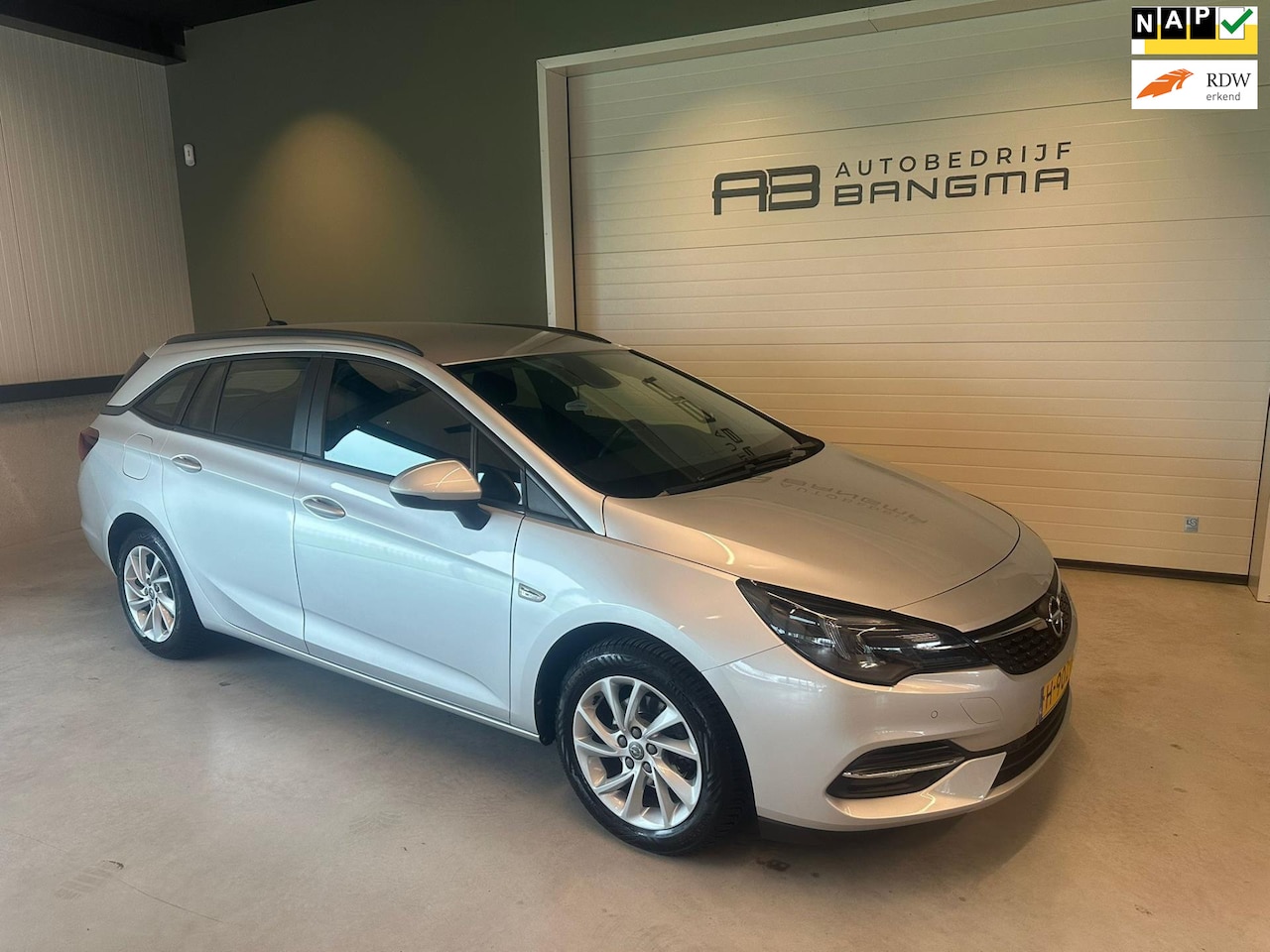 Opel Astra - 1.2 TURBO EDITION-uitv/CLIMA AIRCO/NAVIGATIE/CRUISECONTROL/ISOFIX/TREKHAAK/BLUETOOTH/nieuw - AutoWereld.nl