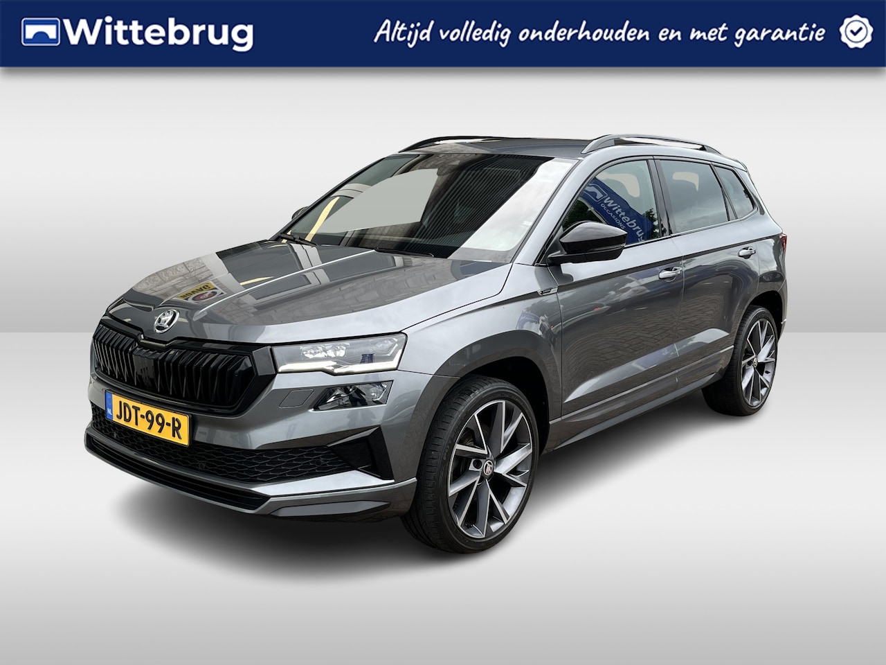 Skoda Karoq - 1.5 TSI ACT Sportline Business / AUTOMAAT/ TREKHAAK/ CAMERA/ PARK. SENSOREN/ CRUISE/ MATRI - AutoWereld.nl
