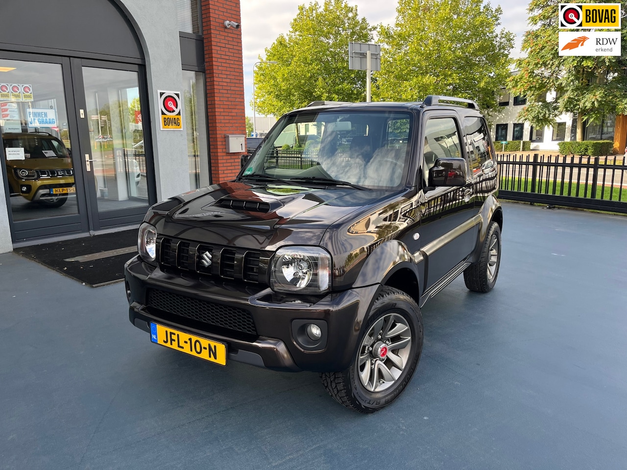 Suzuki Jimny - 1.3 Exclusive 4X4 LEDER STOELVERWAMING AIRCO - AutoWereld.nl