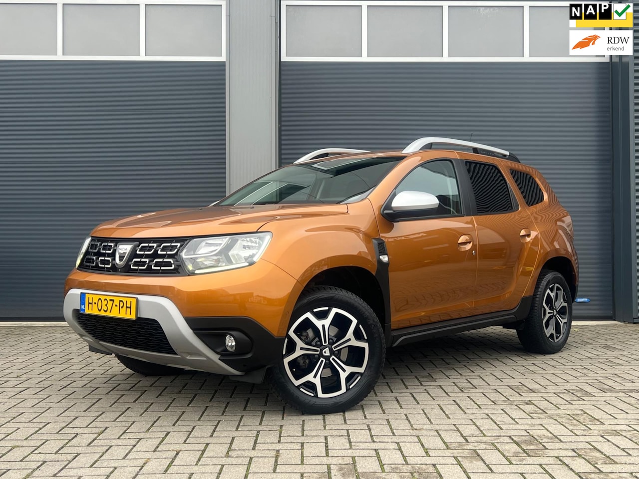 Dacia Duster - 1.3 TCe Prestige | Leer | Navi | Camera | Keyless - AutoWereld.nl