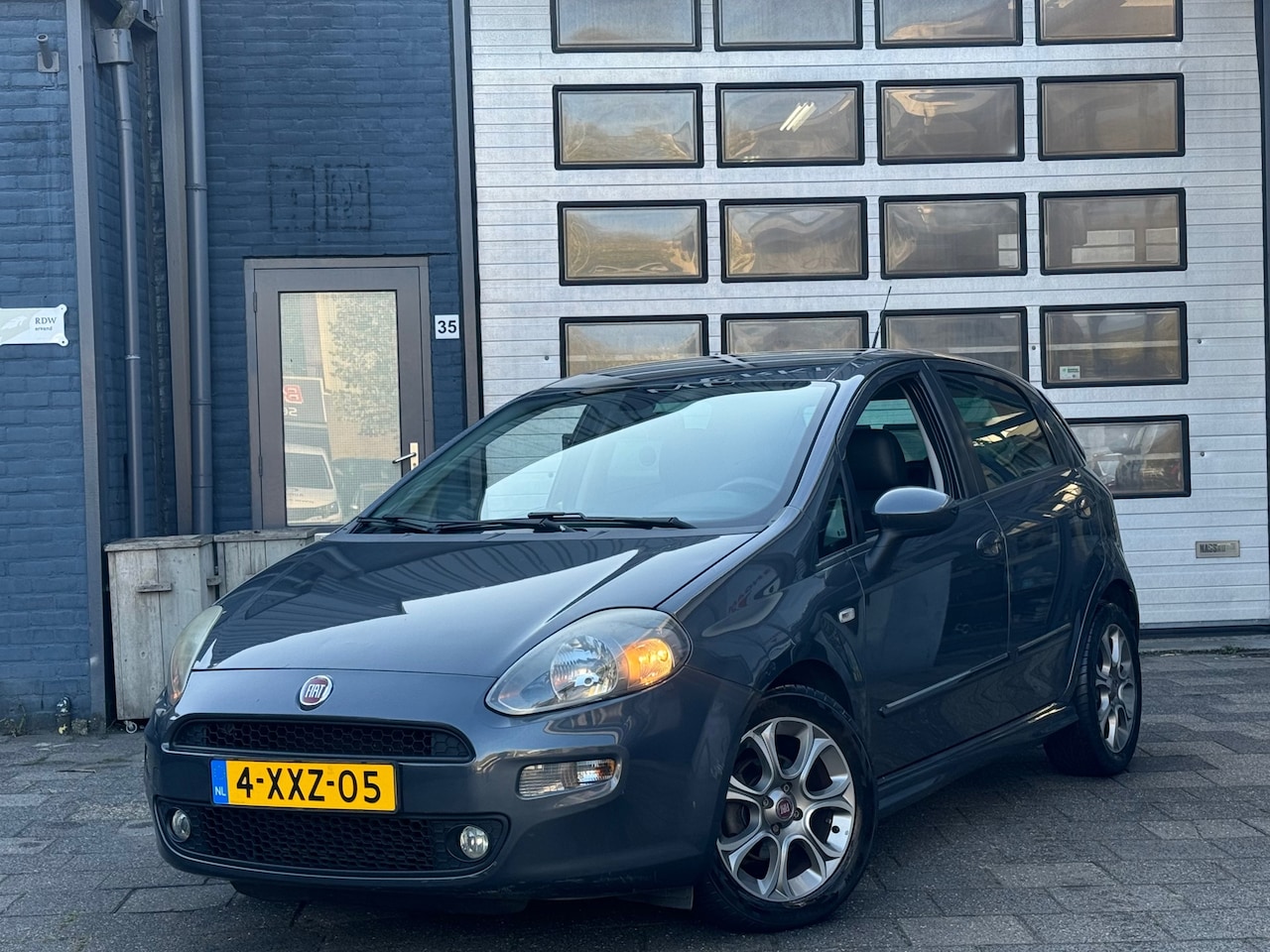 Fiat Punto Evo - 0.9 TwinAir Lounge | Clima | Cruise | PDC | 5-DRS - AutoWereld.nl
