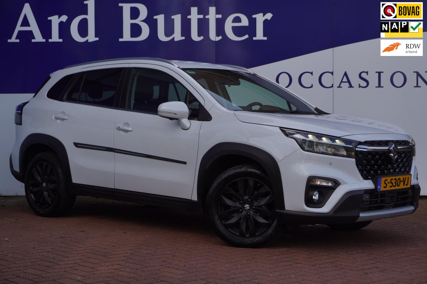 Suzuki S-Cross - 1.4 Boosterjet Style Smart Hybrid+Led+Navigatie+camera+half-Leder+Parel-White+Afneembare-t - AutoWereld.nl