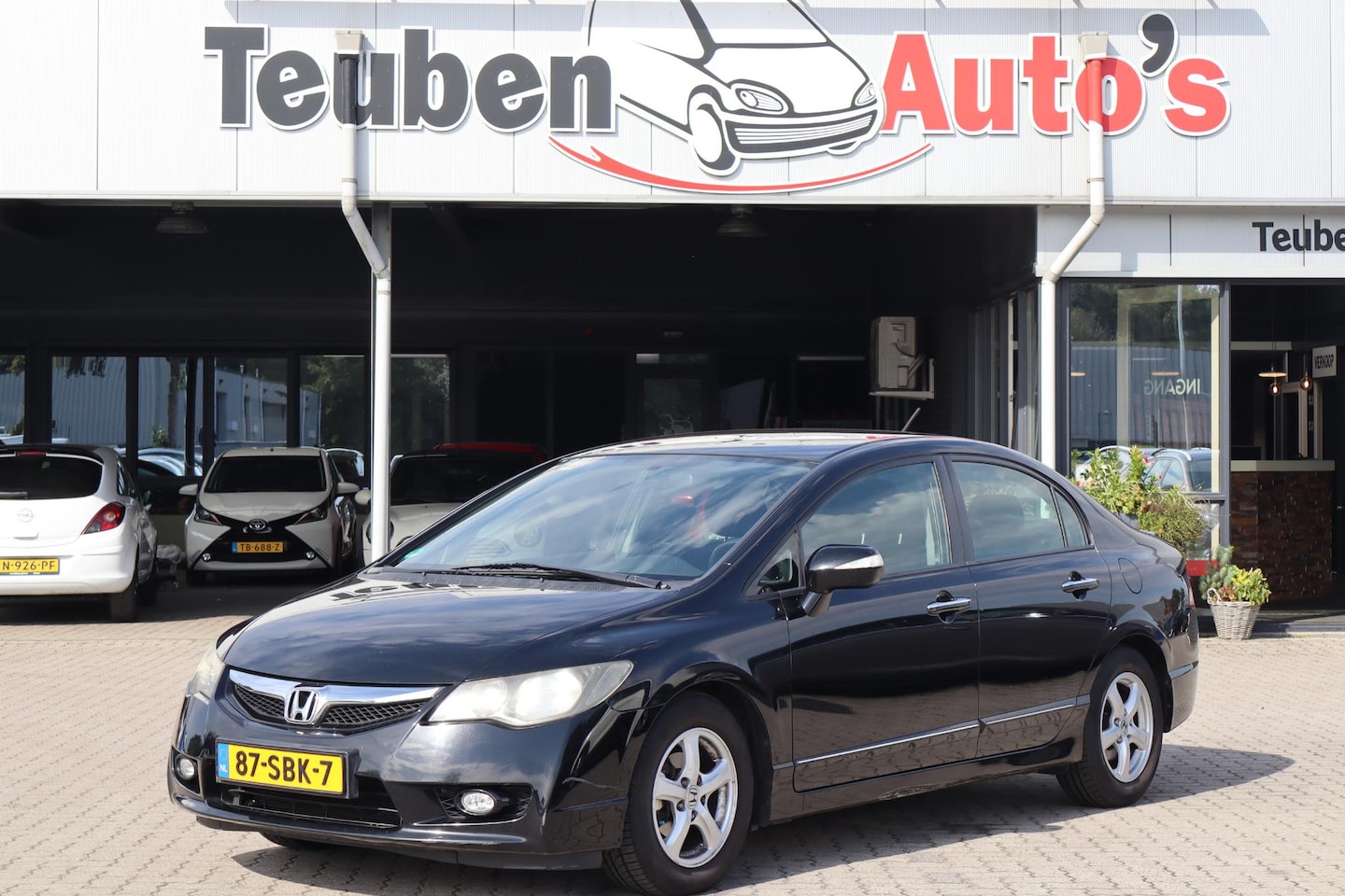 Honda Civic - 1.3 Hybrid Elegance Climate control, Cruise control, Lichtmetalen wielen - AutoWereld.nl