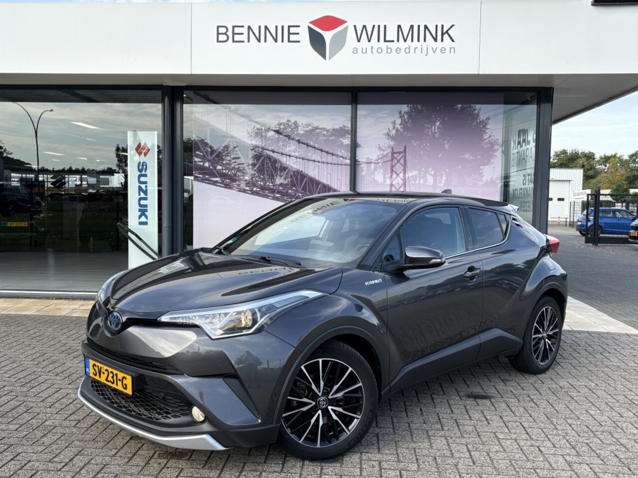 Toyota C-HR - 1.8 Hybrid Executive | Navigatie | Camera - AutoWereld.nl