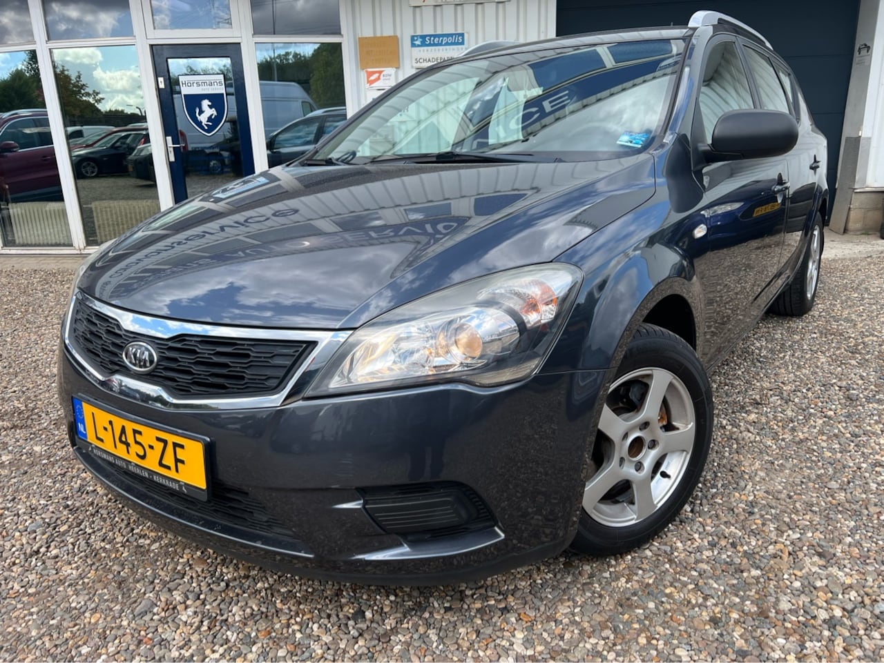 Kia Cee'd Sporty Wagon - 1.4 CVVT X-tra 1.4 CVVT X-tra - AutoWereld.nl