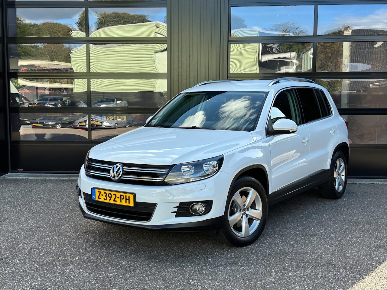 Volkswagen Tiguan - 1.4 TSI Comfort&Design Edition Airco Navi Cruise Stoelverw. - AutoWereld.nl
