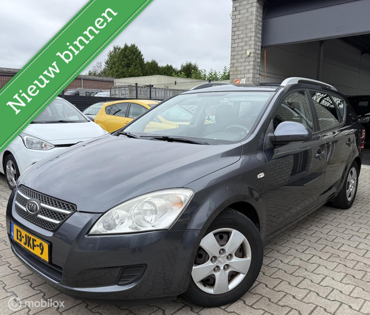Kia Cee'd Sporty Wagon - 1.4 X-tra ISG / Navi / Origineel NL - AutoWereld.nl