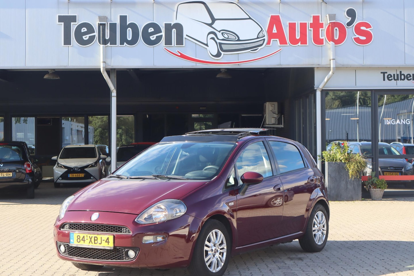Fiat Punto Evo - 1.3 M-Jet Lounge Panoramadak, Schuif- kanteldak, Cruise control, Radio cd speler, Climate - AutoWereld.nl