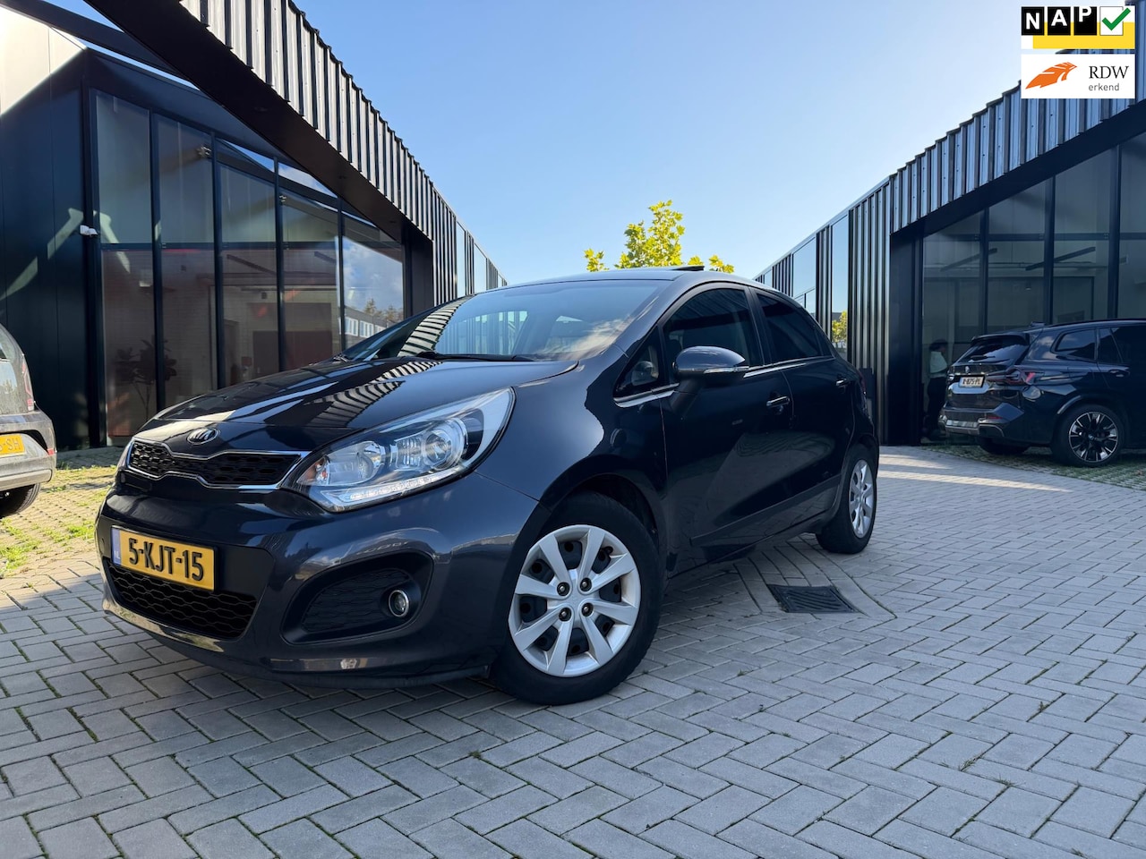 Kia Rio - 1.2 CVVT Super Pack Pano Clima Cruise Keyless Nwe APK NL Auto NAP - AutoWereld.nl