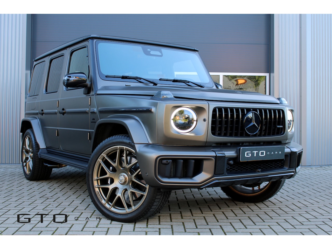 Mercedes-Benz G-klasse - AMG 63 G MANUFAKTUR PAINT/TEAK HOUT LAADRUIMTE/FULL OPTION - AutoWereld.nl