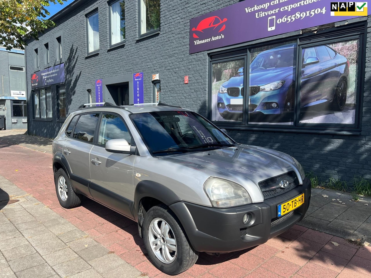 Hyundai Tucson - 2.0i Dynamic airco trekhaak - AutoWereld.nl