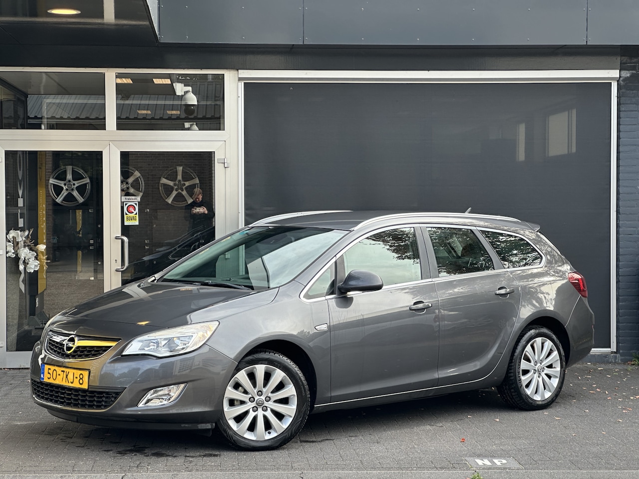 Opel Astra Sports Tourer - 1.4 Turbo Cosmo AUTO / CRUISE / CLIMA / ELEKT. SPIEGELS - AutoWereld.nl