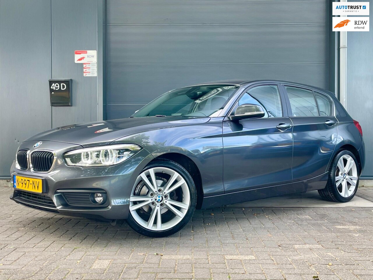 BMW 1-serie - 118i Corporate Lease SPORT AUTOMAAT NAVI BLUETOOTH CRUISE LED HALFLEER 18'' VELGEN MF STUU - AutoWereld.nl