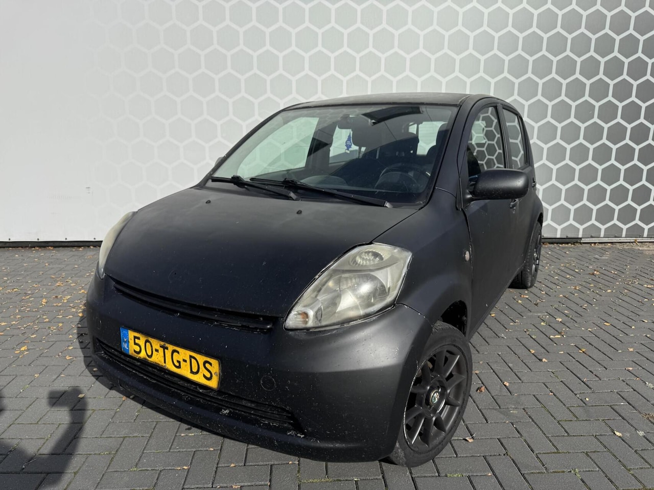 Daihatsu Sirion 2 - 1.0-12V Trend airco lichtmetaal inruilkoop - AutoWereld.nl