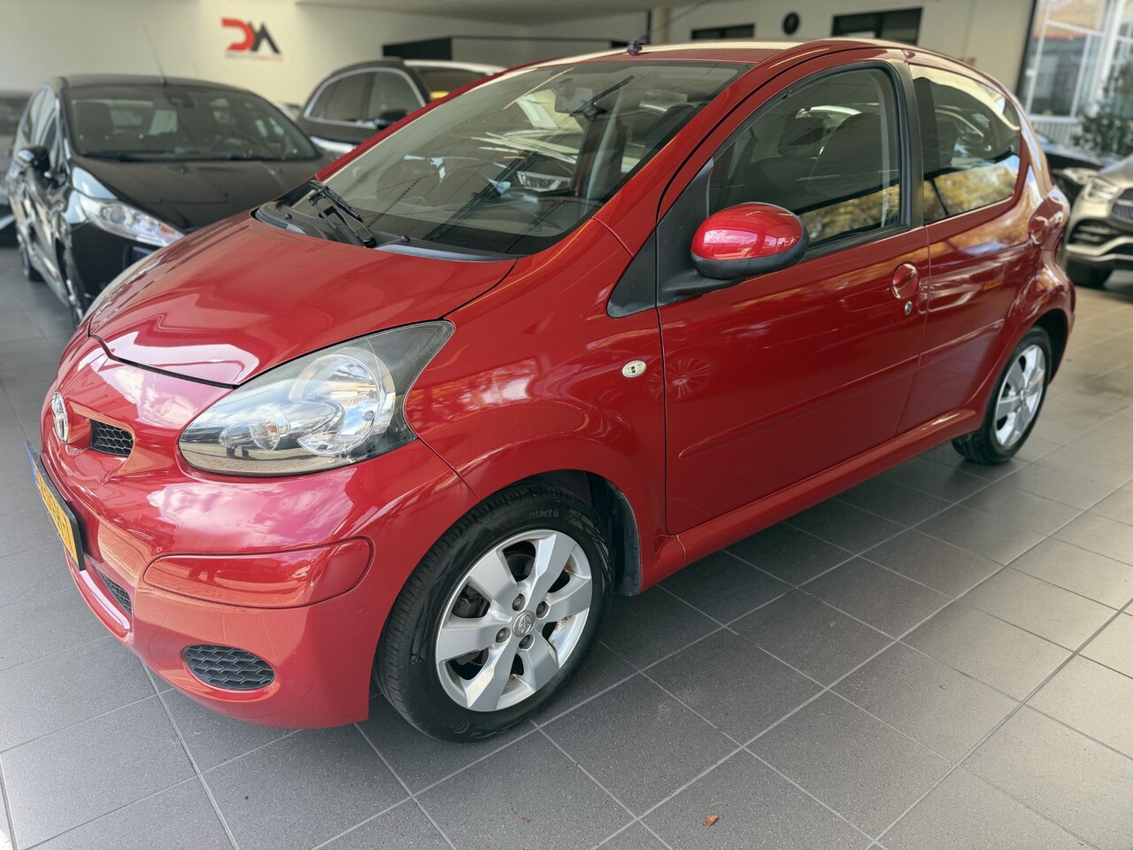 Toyota Aygo - 1.0-12V Aspiration Red Navigator 1.0-12V Aspiration Red Navigator - AutoWereld.nl