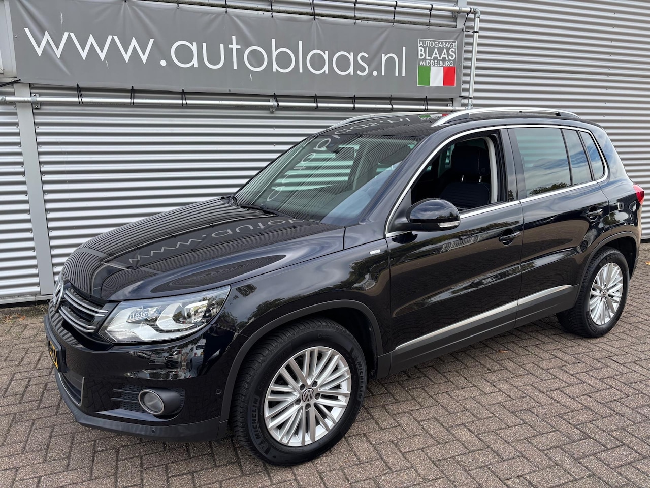 Volkswagen Tiguan - 1.4 TSI Sport&Style DSG Automaat - AutoWereld.nl