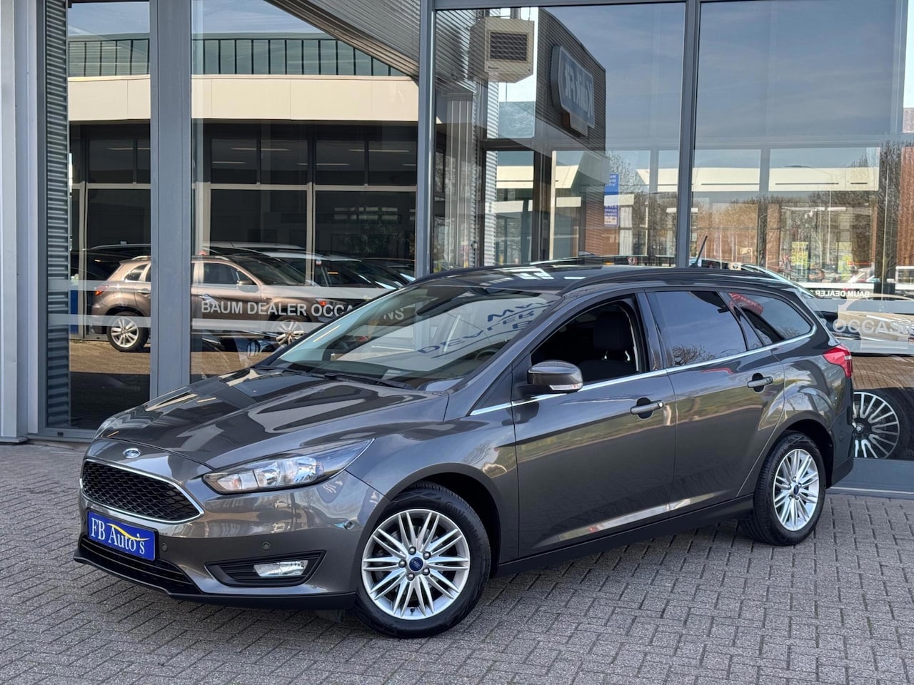 Ford Focus Wagon - 1.0 EcoBoost Titanium Airco Navi Lmv Cruise PDC - AutoWereld.nl