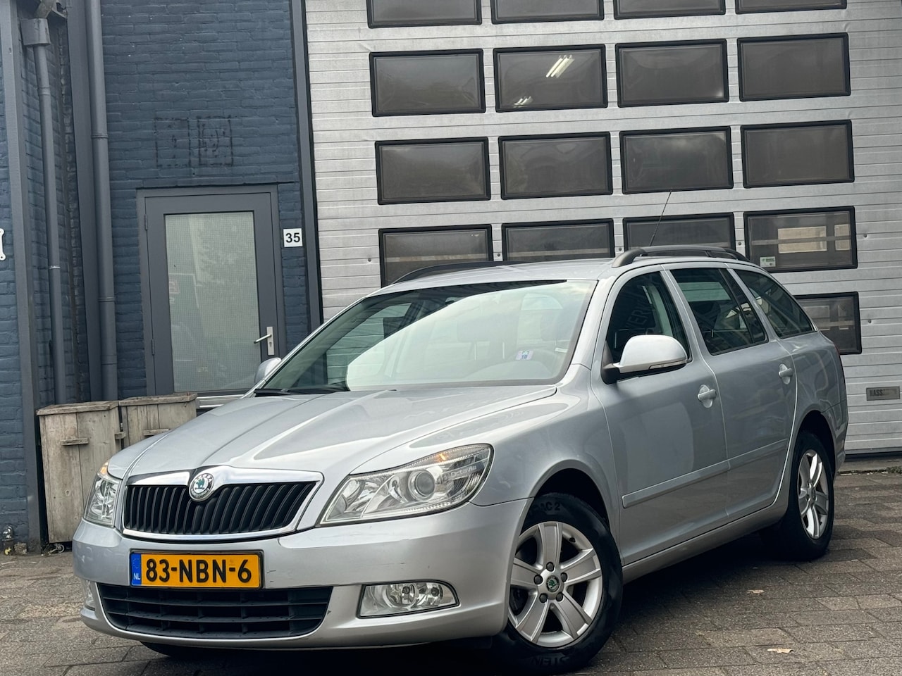 Skoda Octavia Combi - 1.2 TSI Ambition | Airco | Navi | Cruise - AutoWereld.nl