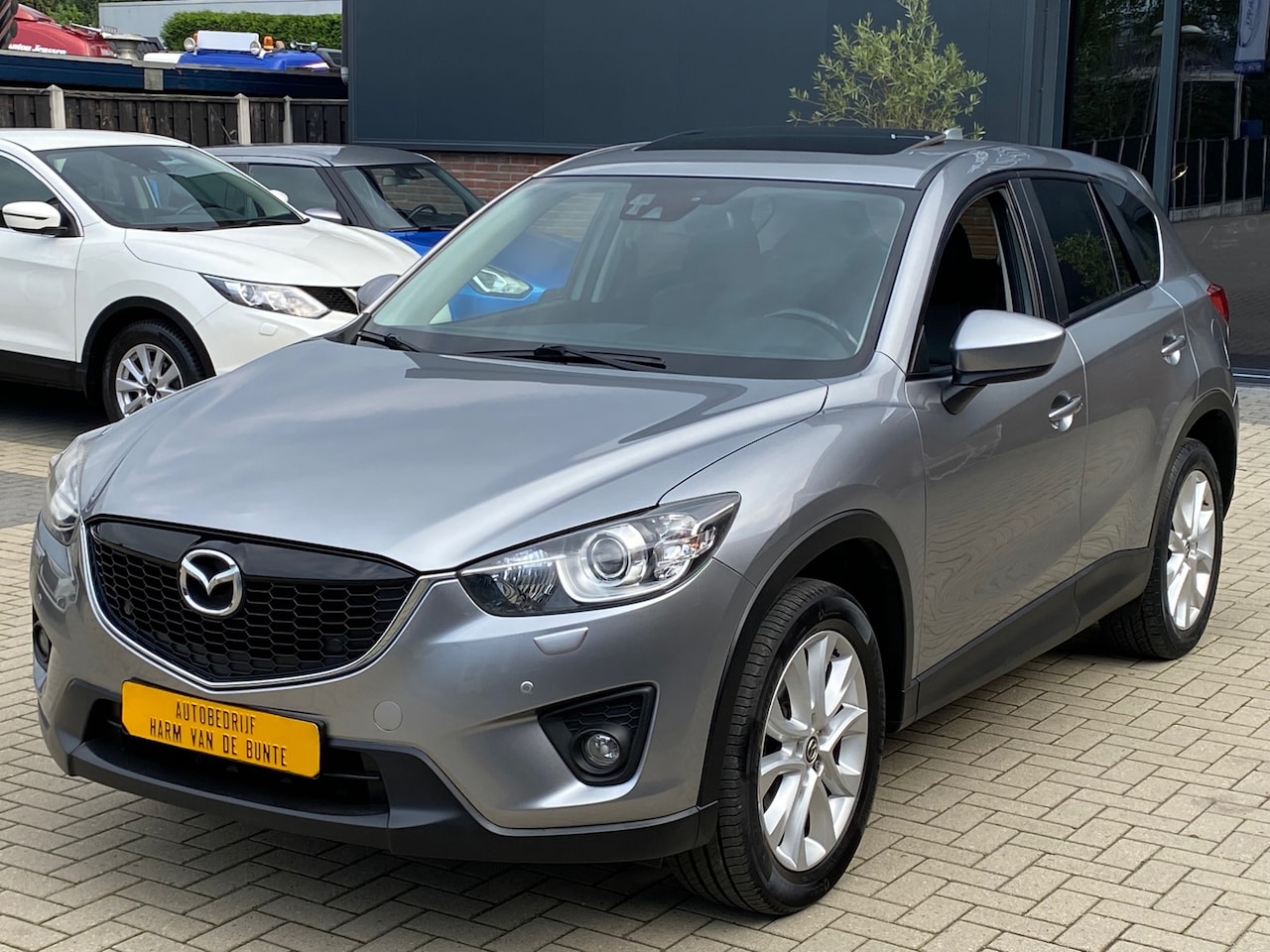 Mazda CX-5 - 2.0 TS+ 4WD NIEUWSTAAT AUTOMAAT LEER NAVI XENON CRUISE PANO KEYLESS - AutoWereld.nl