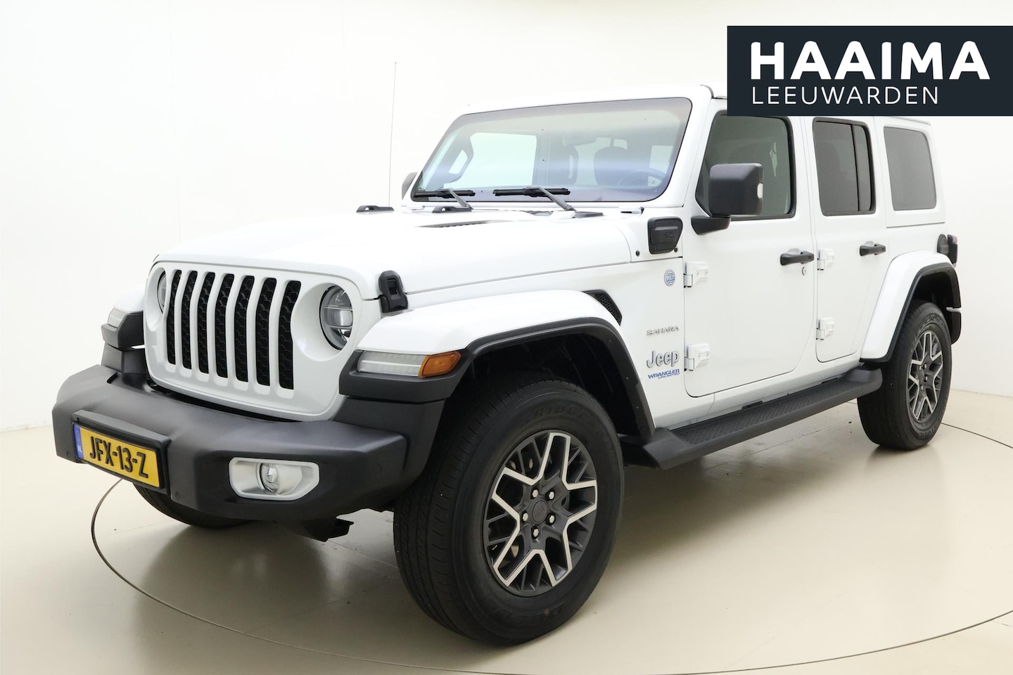 Jeep Wrangler Unlimited - 4xe 380 Sahara Uitneembaar dak | cruise & climate control | full map navigatie - AutoWereld.nl