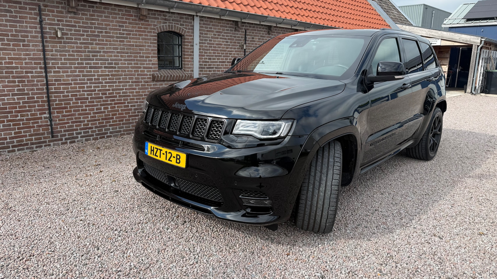 Jeep Grand Cherokee - 6.4 Hemi SRT Jeep Grand Cherokee 6.4 Hemi SRT8 PANO dak en Harman/Kardon 5 zitter - AutoWereld.nl