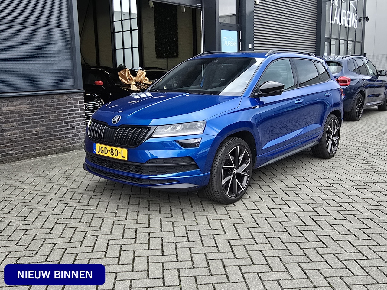 Skoda Karoq - 2.0 TSI 4x4 Sportline Business | Pano | ACC | Canton - AutoWereld.nl