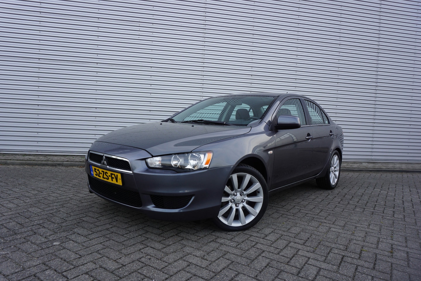 Mitsubishi Lancer Sports Sedan - 1.8 Invite Airco / Cruise / Elektr. ramen / Trekhaak / Lm velgen / NAP - AutoWereld.nl