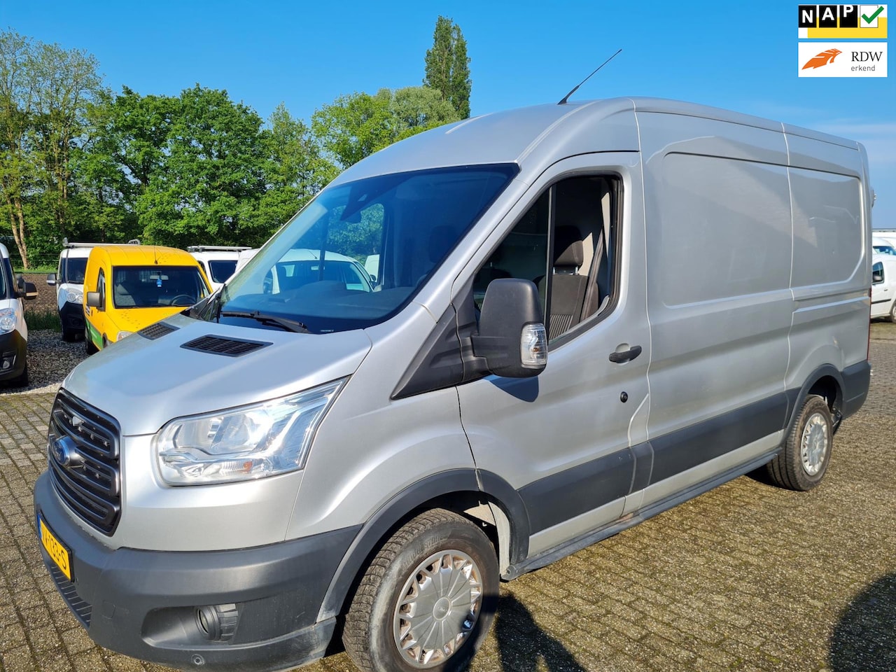 Ford Transit - 310 2.2 TDCI L2H2 Trend airco cruise navi pdc - AutoWereld.nl