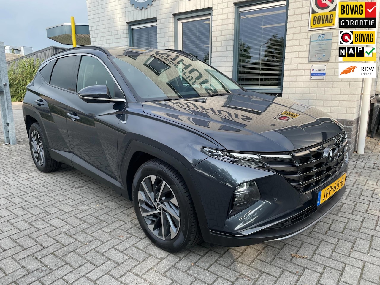 Hyundai Tucson - 1.6 T-GDI MHEV Comfort Smart / Camera / PDC V+A / Carplay / Telefoon / Navigatie / Cruise - AutoWereld.nl