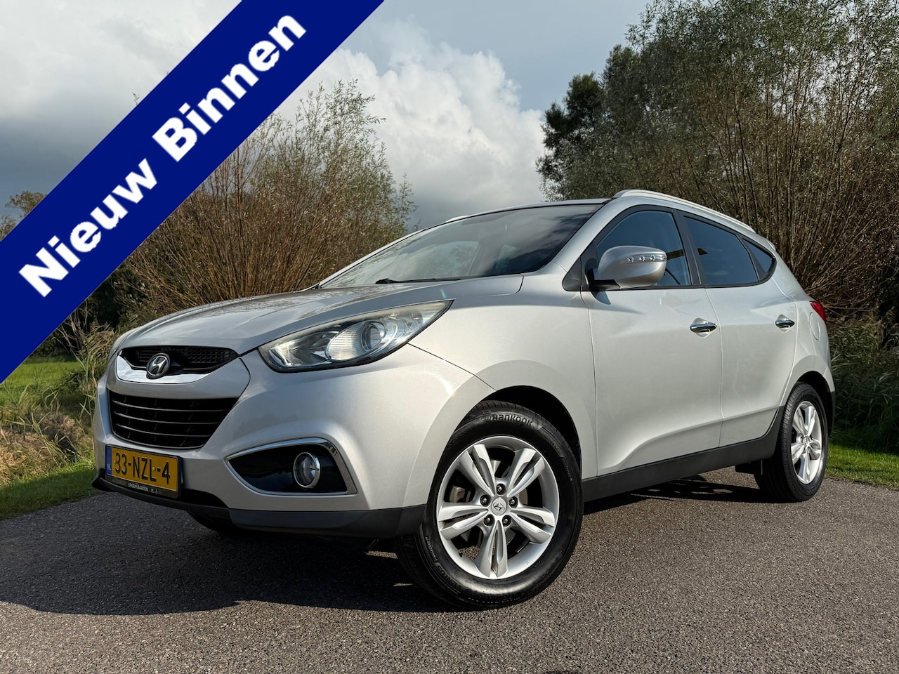 Hyundai ix35 - 2.0i Style | 1e Eigenaar | Leder | Clima | Stoelverwarming | 17" Velgen | BT/AUX/USB | Cru - AutoWereld.nl