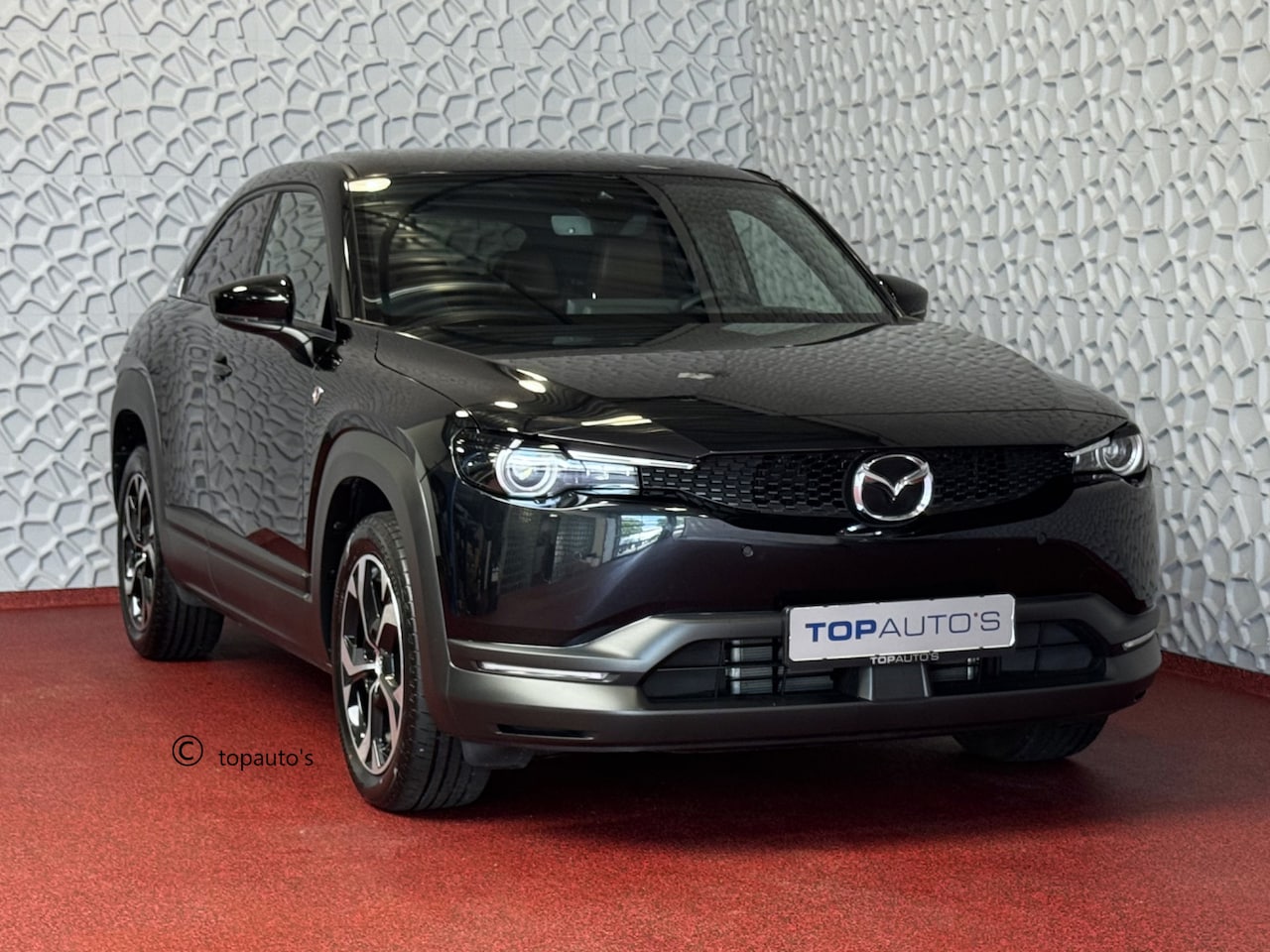 Mazda MX-30 - E-SKYACTIV R-EV PHEV 170PK ELEK.STOEL H.U.D CAMERA LED PLUG IN HYBRID - AutoWereld.nl