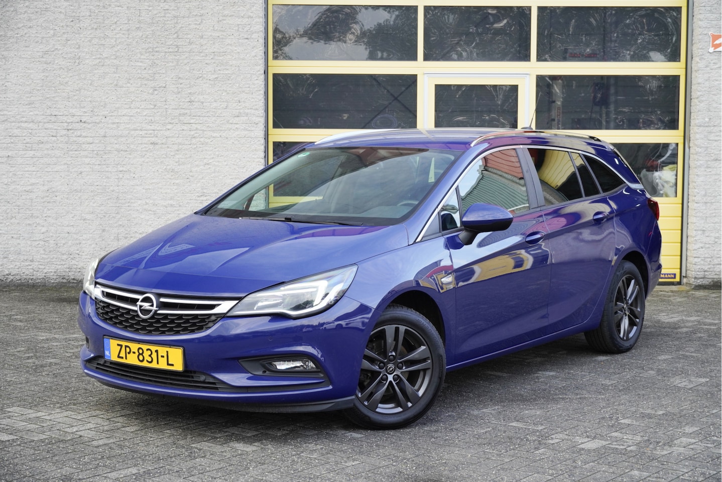 Opel Astra Sports Tourer - 1.0 Turbo 120 Jaar Edition BJ2019 Lmv 16" | Led | Pdc | Navi | Trekhaak | Climate control - AutoWereld.nl