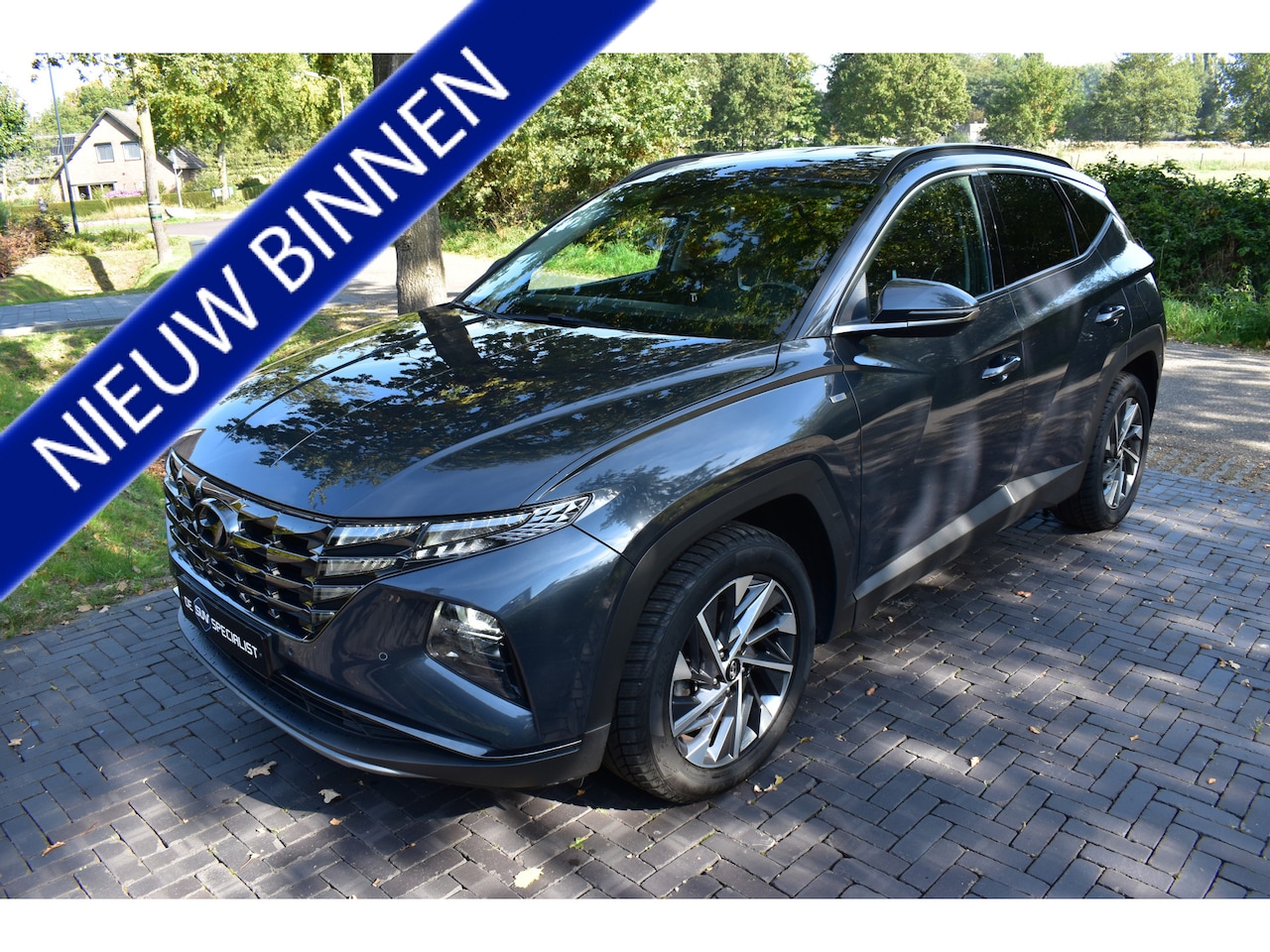 Hyundai Tucson - 1.6 T-GDI HEV Premium LEER, TREKHAAK NIEUWST. - AutoWereld.nl