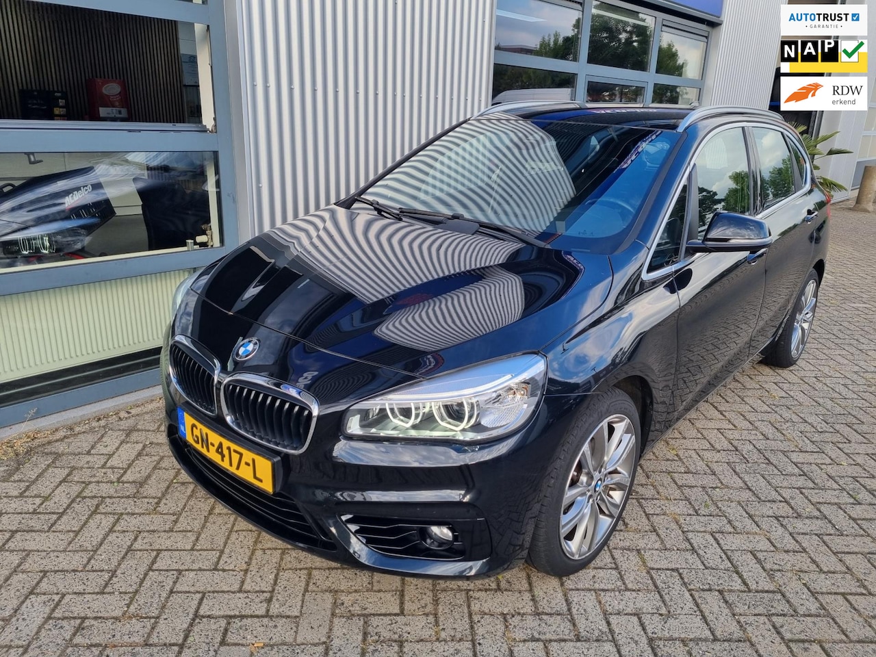 BMW 2-serie Active Tourer - 218i Sport | trekhaak | navi | cruise control | pdc - AutoWereld.nl