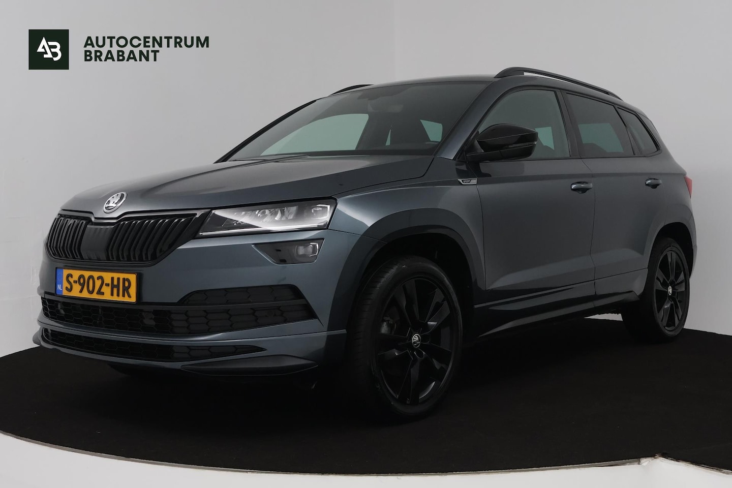 Skoda Karoq - 1.5 TSI ACT Sportline Business (DIGITALE COCKPIT, STOEL/STUUR VERWARMING, TREKHAAK, SFEERV - AutoWereld.nl