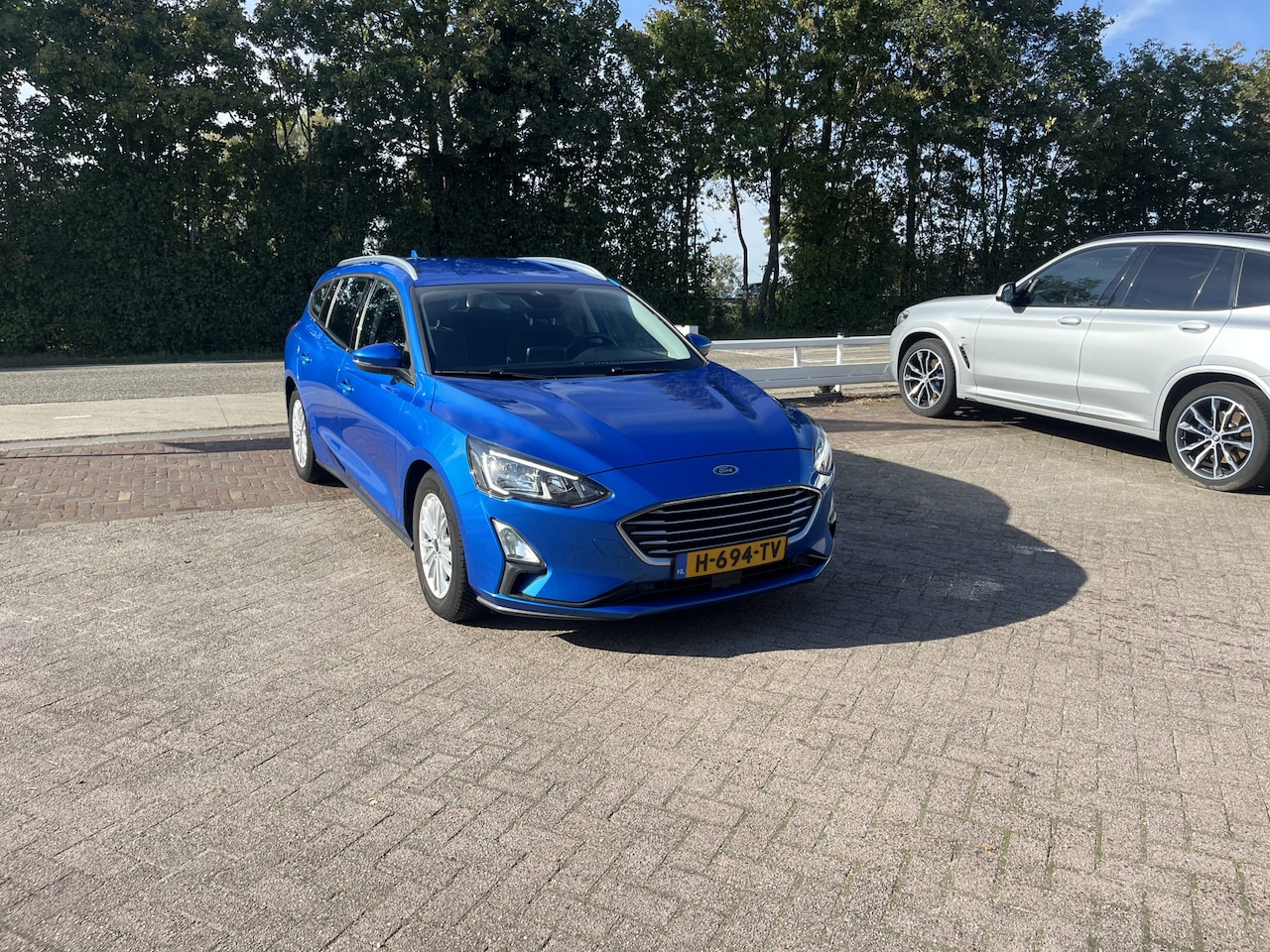 Ford Focus Wagon - 1.0 EcoBoost Titanium Business TREKHAAK CLIMA ADD CRUISE - AutoWereld.nl