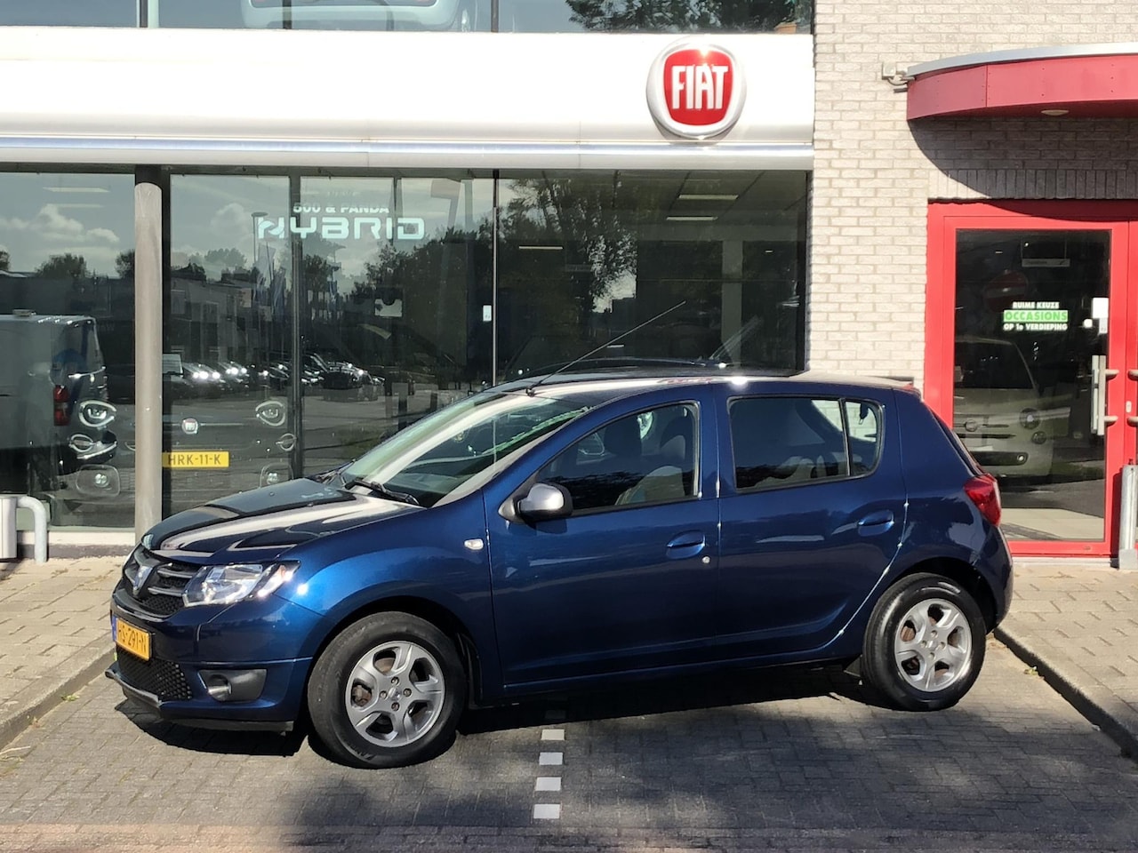 Dacia Sandero - 0.9 TCe 10th Anniversary AIRCO|CRUISE CONTROL|TREKHAAK|PDC|15" - AutoWereld.nl