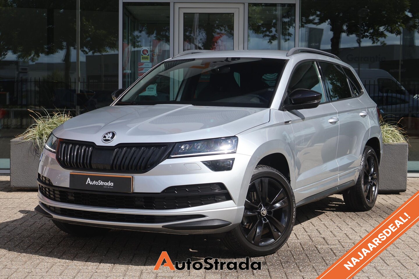 Skoda Karoq - 1.5 SportLine TSI ACT 150pk | Canton | Camera | LED | Navi | Cruise | Climate | Carplay | - AutoWereld.nl