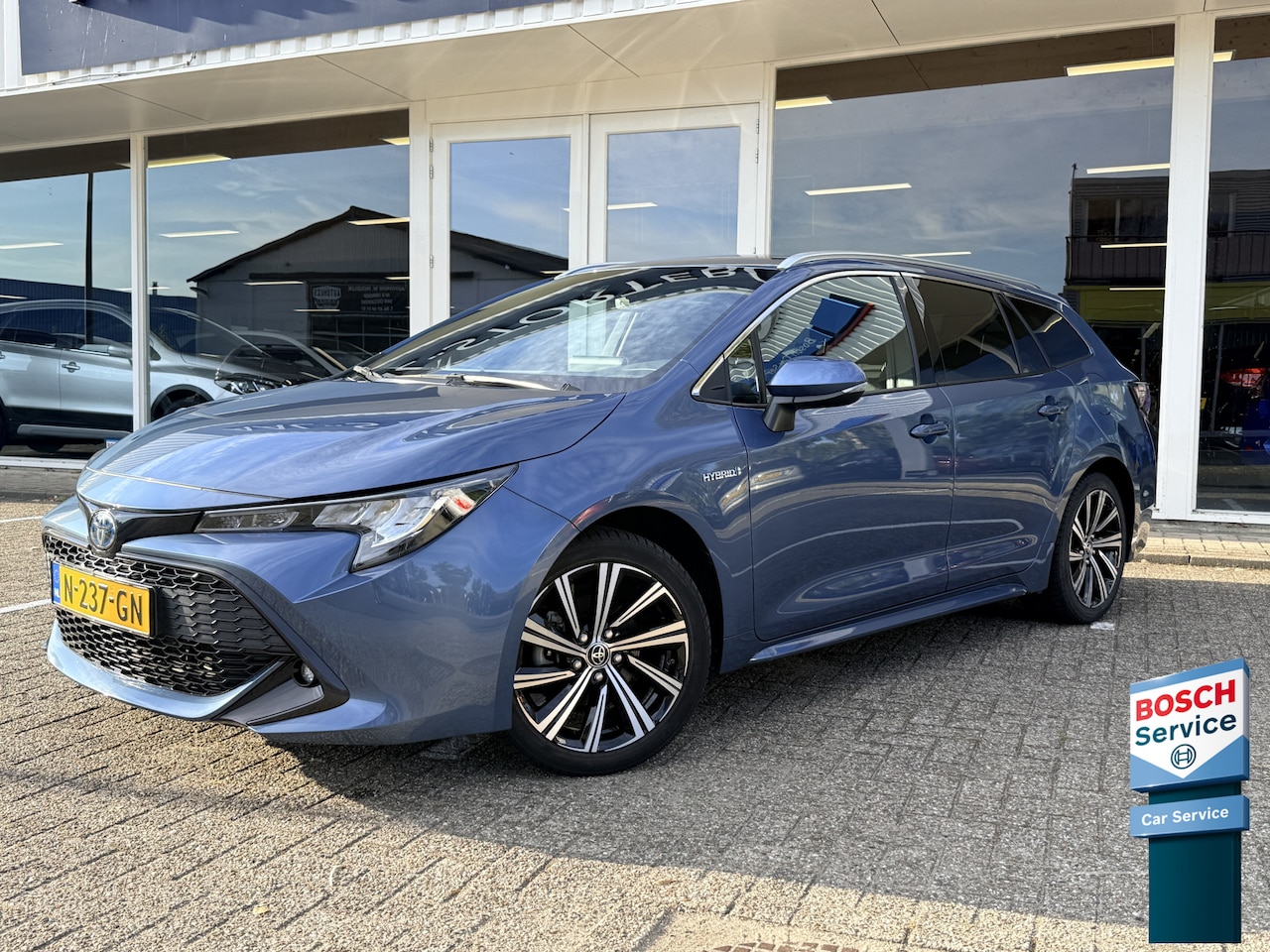 Toyota Corolla Touring Sports - 1.8 Hybrid Business Plus | LED | Keyless | Adapt. Cruise | Apple Carplay | Camera | Stoelv - AutoWereld.nl